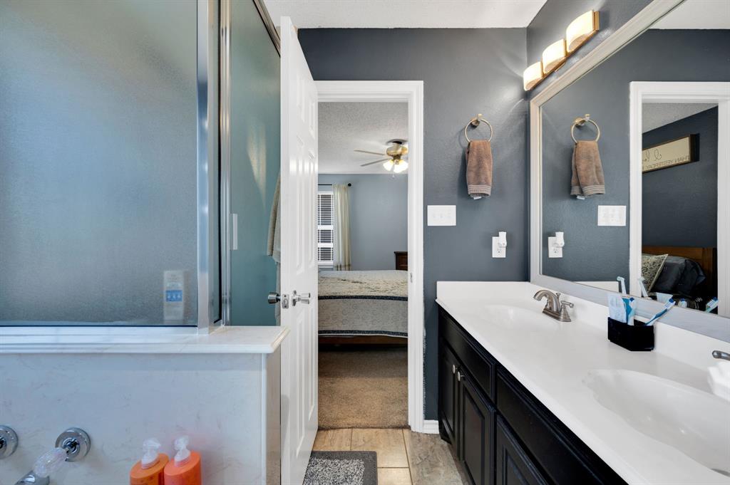 1003 Short Line Boulevard Midlothian, TX 76065 - Photo 24 of 25 Full bathroom featuring connected bathroom, double vanity, and ceiling fan