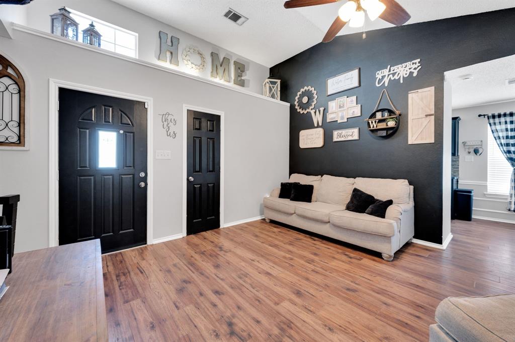 1003 Short Line Boulevard Midlothian, TX 76065 - Photo 5 of 25 Foyer entrance with wood finished floors, a ceiling fan, plenty of natural light, and a high ceiling