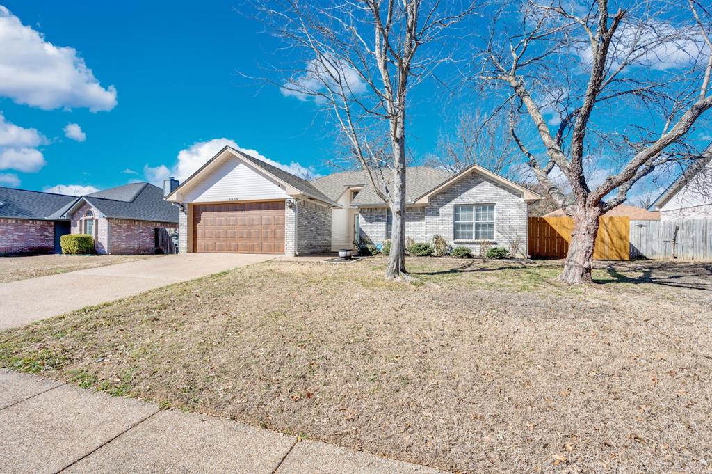 1003 Short Line Boulevard Midlothian, TX 76065 - Photo 7 of 25 Single story home with concrete driveway, brick siding, and a garage