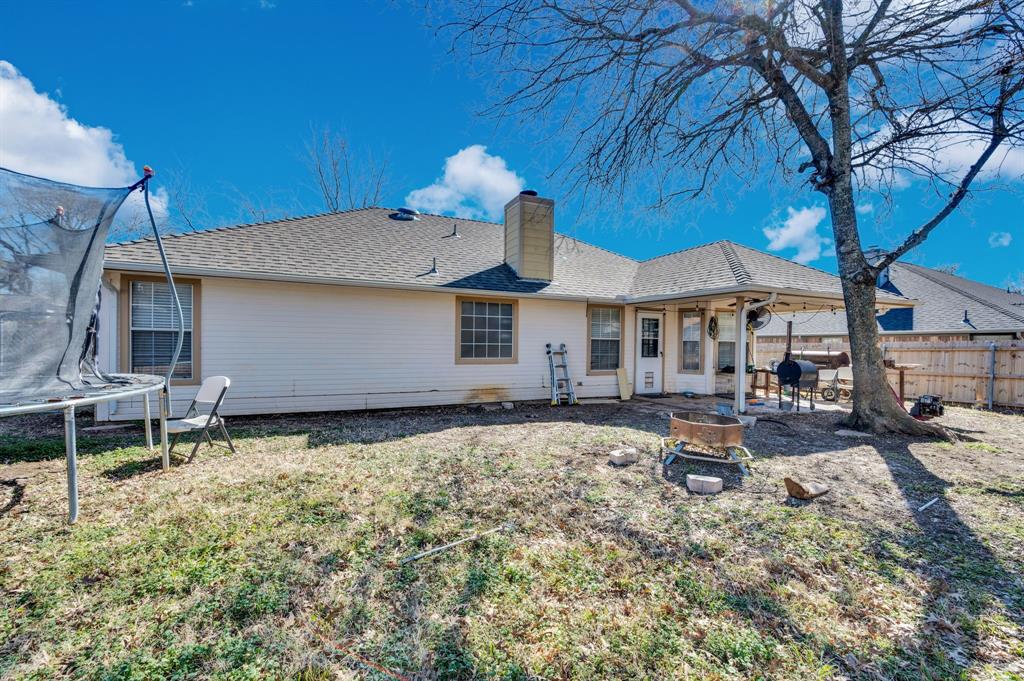 1003 Short Line Boulevard Midlothian, TX 76065 - Photo 10 of 25 Rear view of house featuring a patio, a chimney, a shingled roof, and an outdoor fire pit