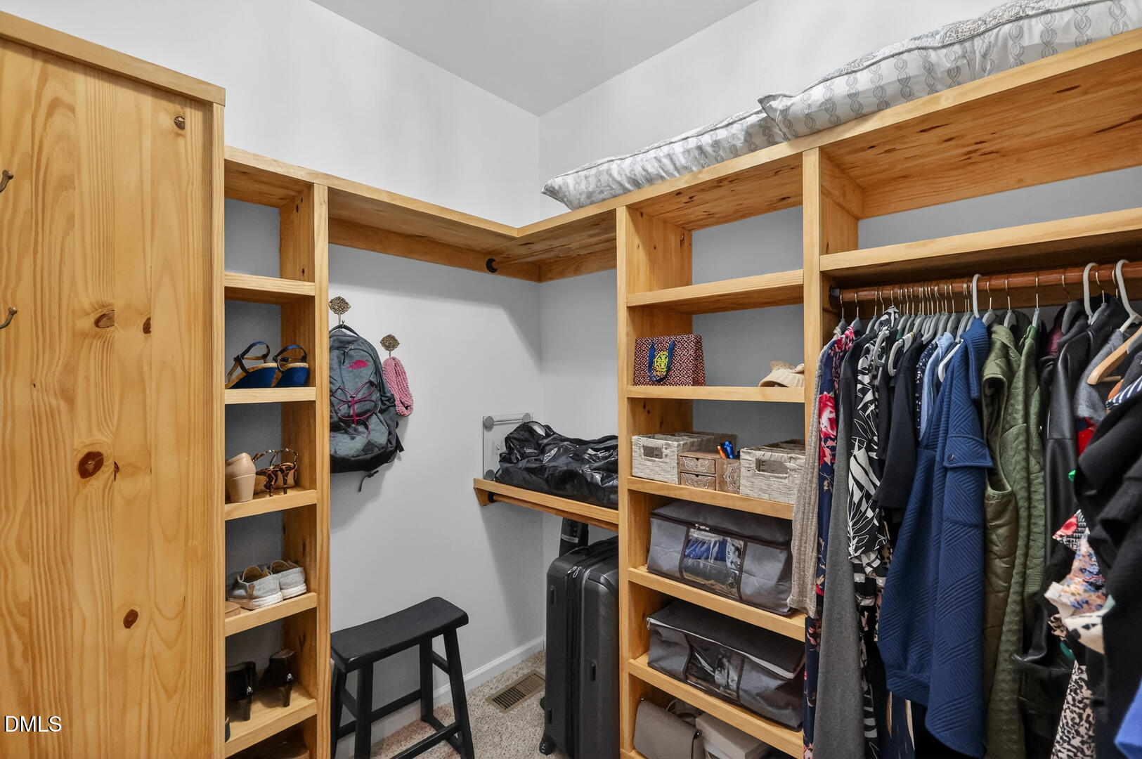 540 Pine Ridge Road Zebulon, NC 27597 - Photo 34 of 96 a view of walk in closet with clothes and shoes
