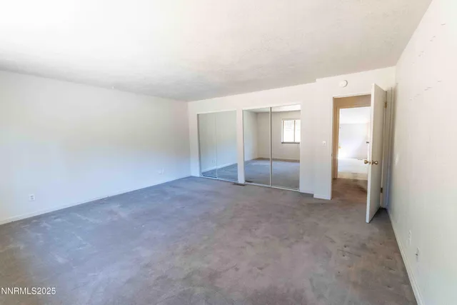 an empty room with a bathroom