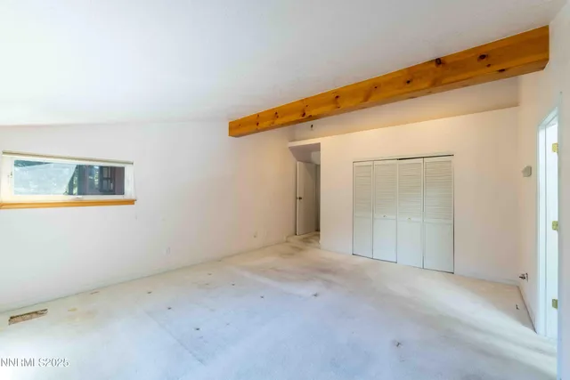 a spacious bathroom with a tub sink and mirror