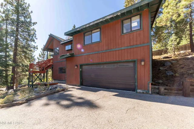 a view of a park with large trees