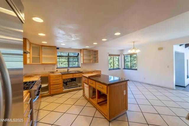a kitchen that has a table and chairs in it
