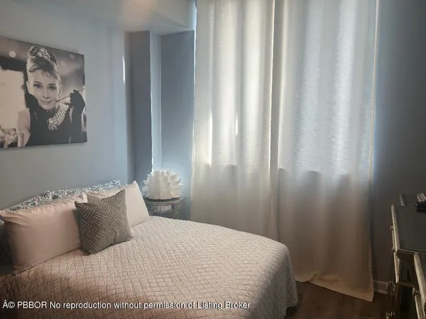 a bedroom with a bed and furniture