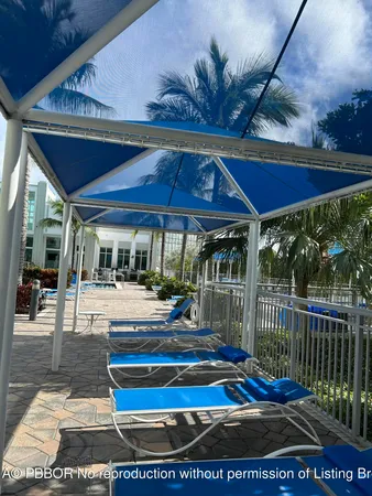 a patio with a patio table and chairs