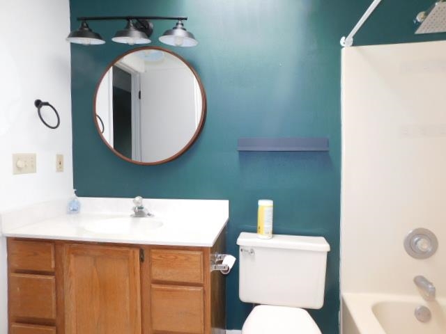 524 Triton Avenue Rockford, IL 61107 - Photo 15 of 18 a bathroom with a toilet sink and mirror