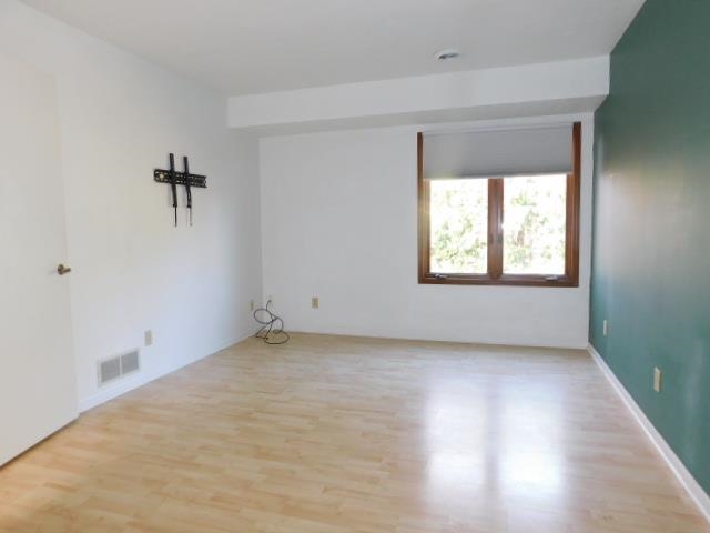 524 Triton Avenue Rockford, IL 61107 - Photo 10 of 18 a view of an empty room with a window