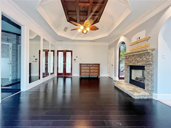 a living room with furniture and kitchen view