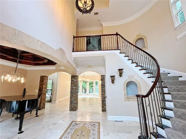 a view of an entryway with wooden floor