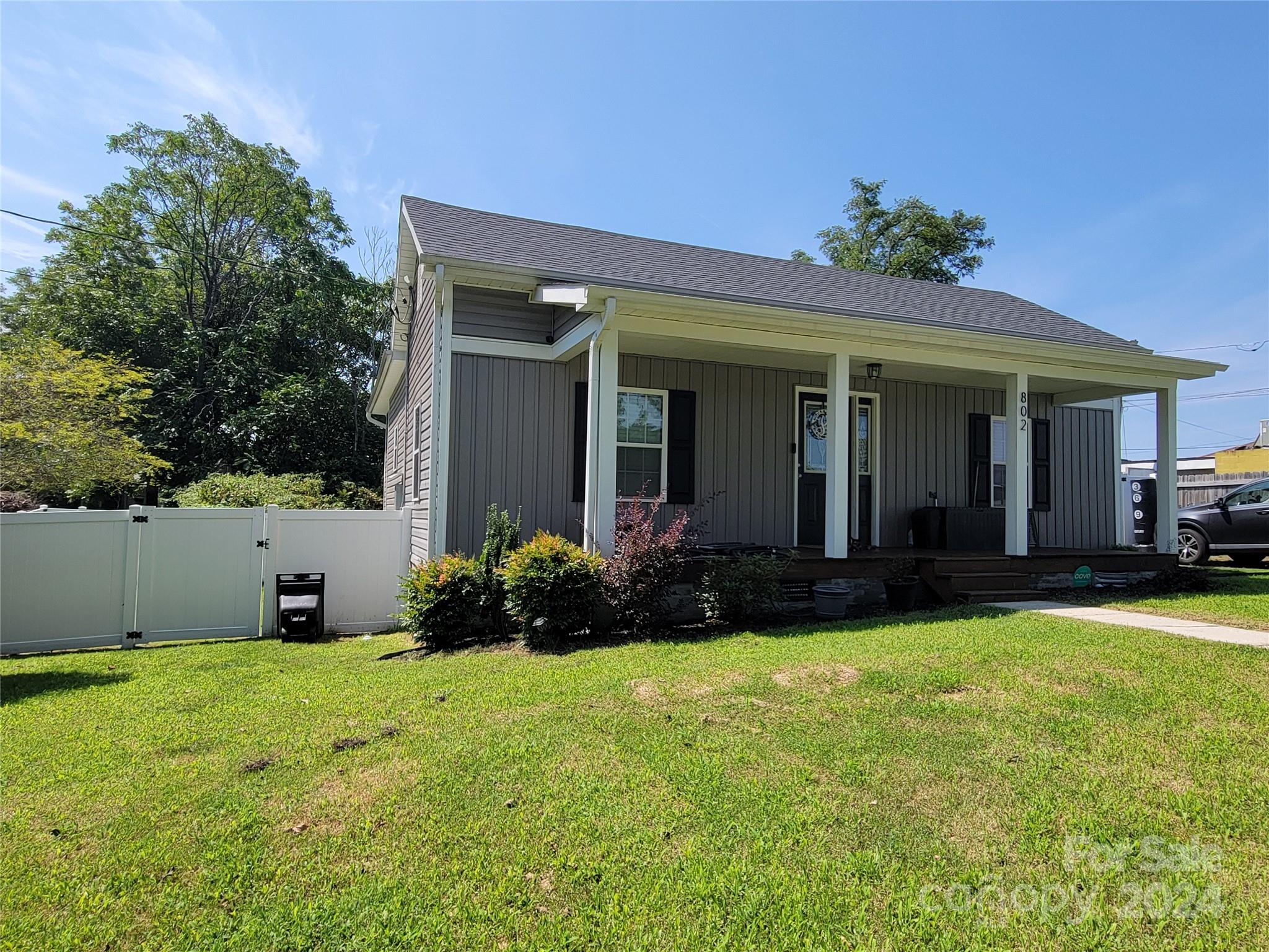 802 McLain Road Kannapolis, NC 28083 - Photo 3 of 20 a view of a house with potted plants and a table