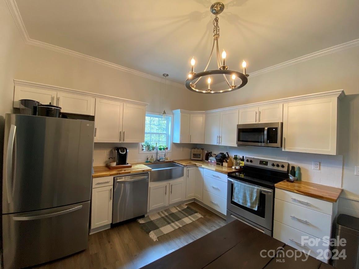 802 McLain Road Kannapolis, NC 28083 - Photo 8 of 20 a kitchen with cabinets a sink and stainless steel appliances