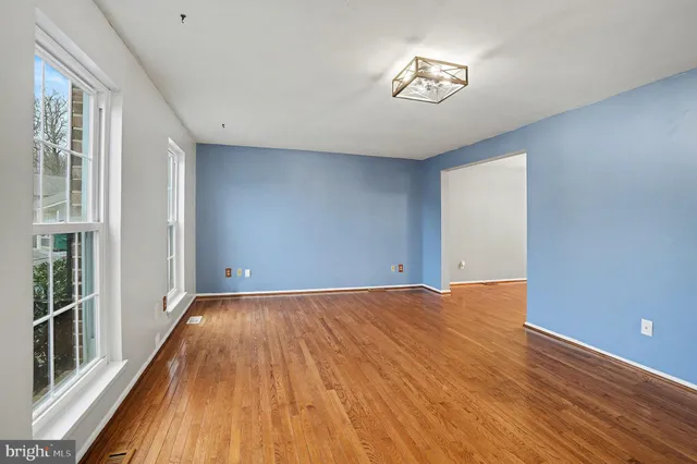 a view of an empty room with glass door