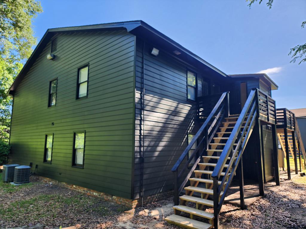 3658 Maryland Circle, Unit D Columbus, GA 31907 - Photo 2 of 5 a front view of a house with street