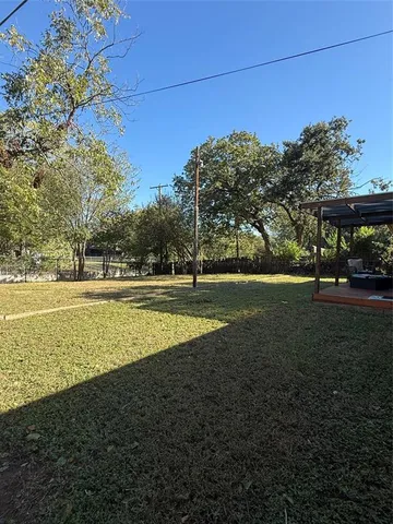 a living room with furniture and large windows