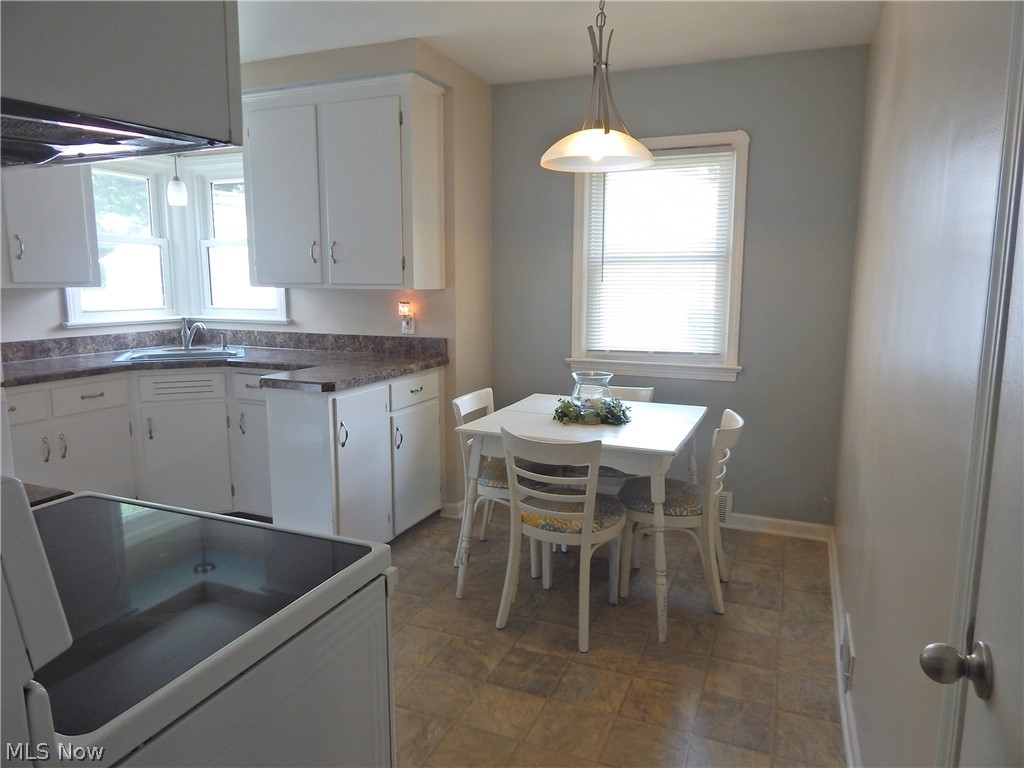 5701 Ackley Road Parma, OH 44129 - Photo 3 of 31 Bright and Airy & always popular White Kitchen. Freshly updated floors and Countertops.