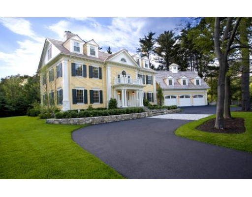 49 Woodland Road Brookline, MA 02467 - Photo 1 of 8 a front view of a house with garden