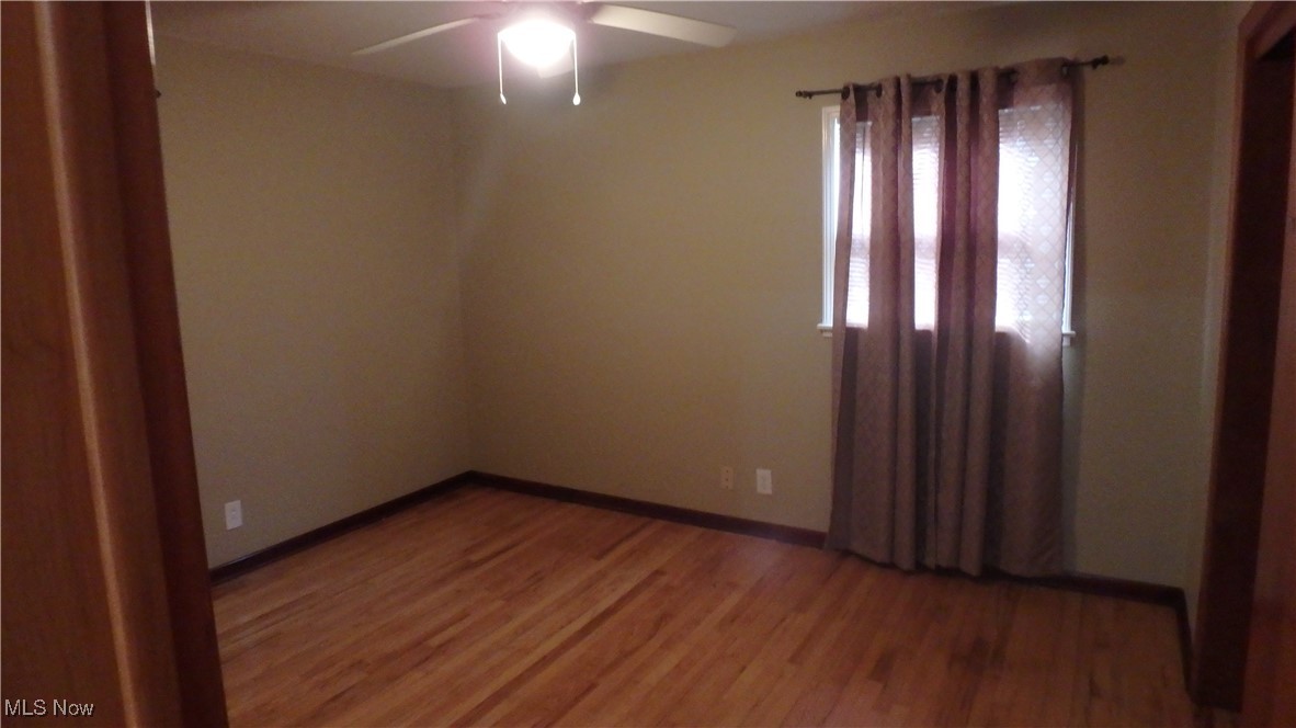 2901 Dentzler Road Parma, OH 44134 - Photo 13 of 25 Spare room with a ceiling fan and light wood finished floors
