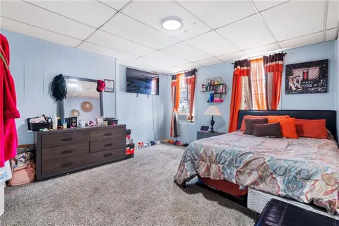 a bedroom with a bed and cabinets