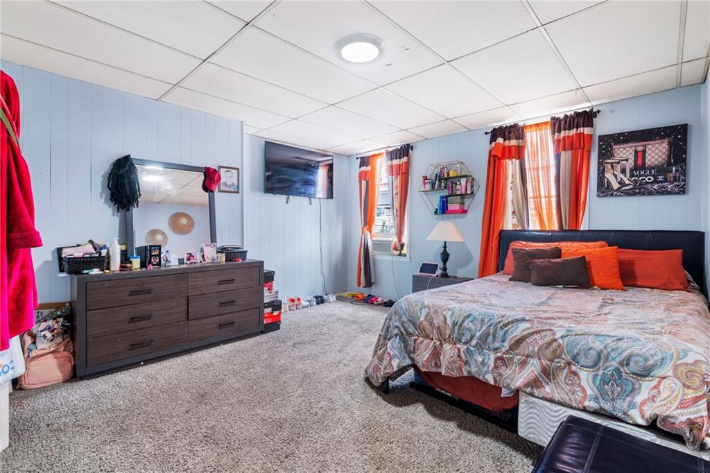2312 Spring Street Pittsburgh, PA 15210 - Photo 13 of 29 a bedroom with a bed and cabinets