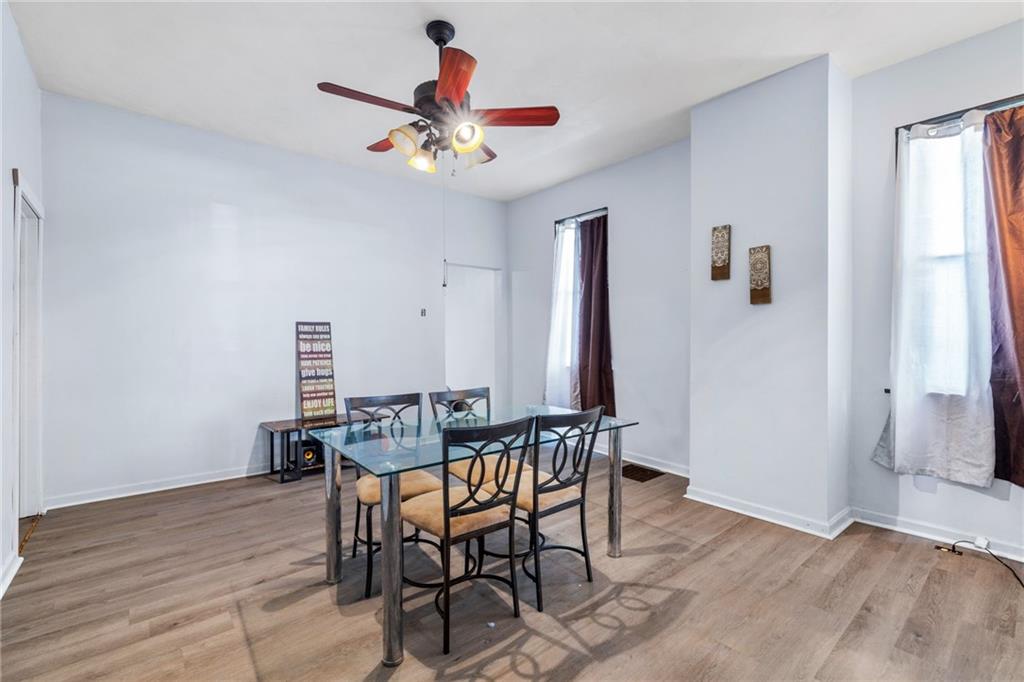2312 Spring Street Pittsburgh, PA 15210 - Photo 20 of 29 a view of a dining room with furniture and wooden floor