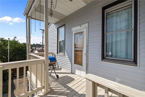 a view of a balcony with a potted plant