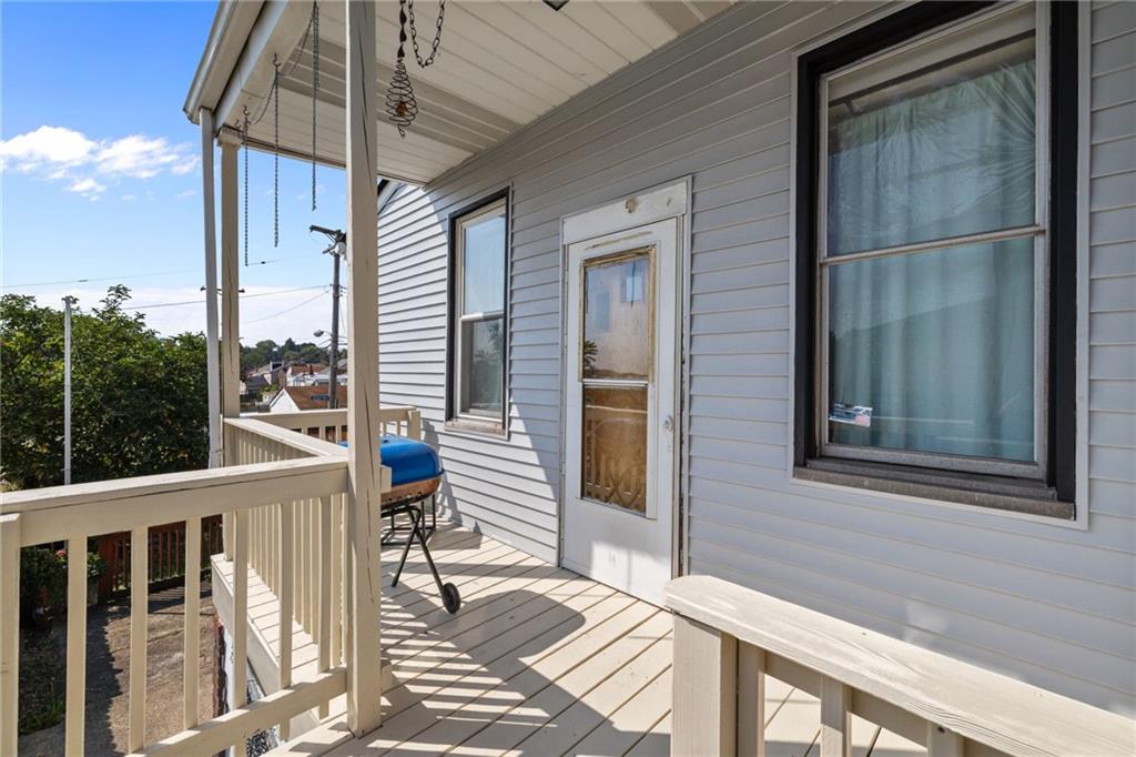 2312 Spring Street Pittsburgh, PA 15210 - Photo 4 of 29 a view of a balcony with a potted plant