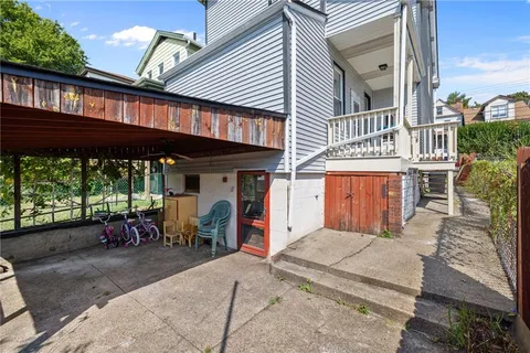 a view of a patio with table and chairs