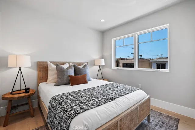 a bedroom with bed and window