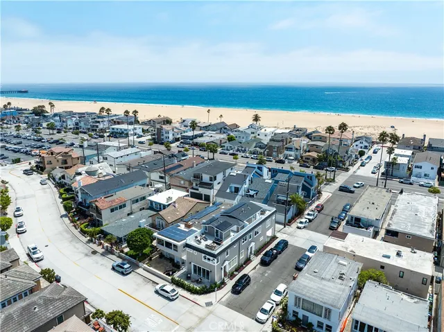 an aerial view of a city and ocean view