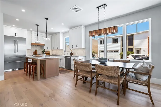 a living room with stainless steel appliances kitchen island granite countertop furniture and a kitchen view