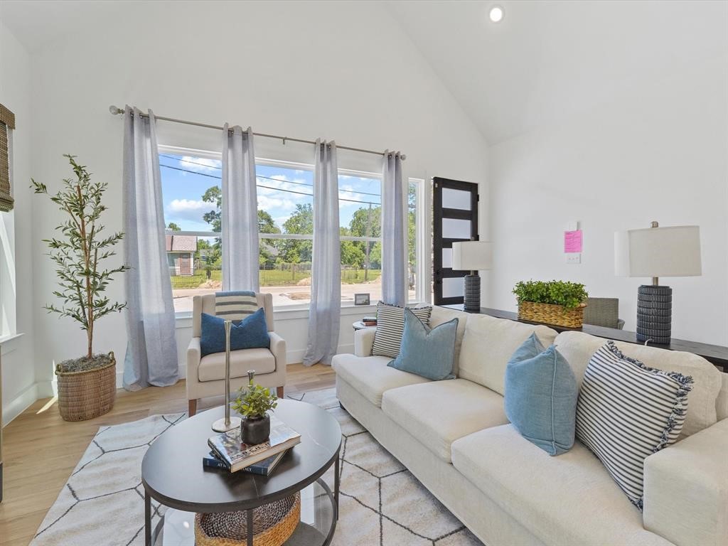 2406 Mann Street, Unit D Houston, TX 77093 - Photo 2 of 15 a living room with furniture and a large window