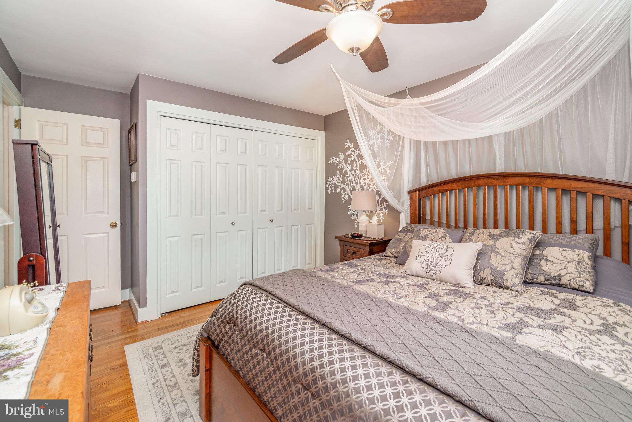 904 South 12th Street Lebanon, PA 17042 - Photo 14 of 32 a bedroom with a bed and wooden floor
