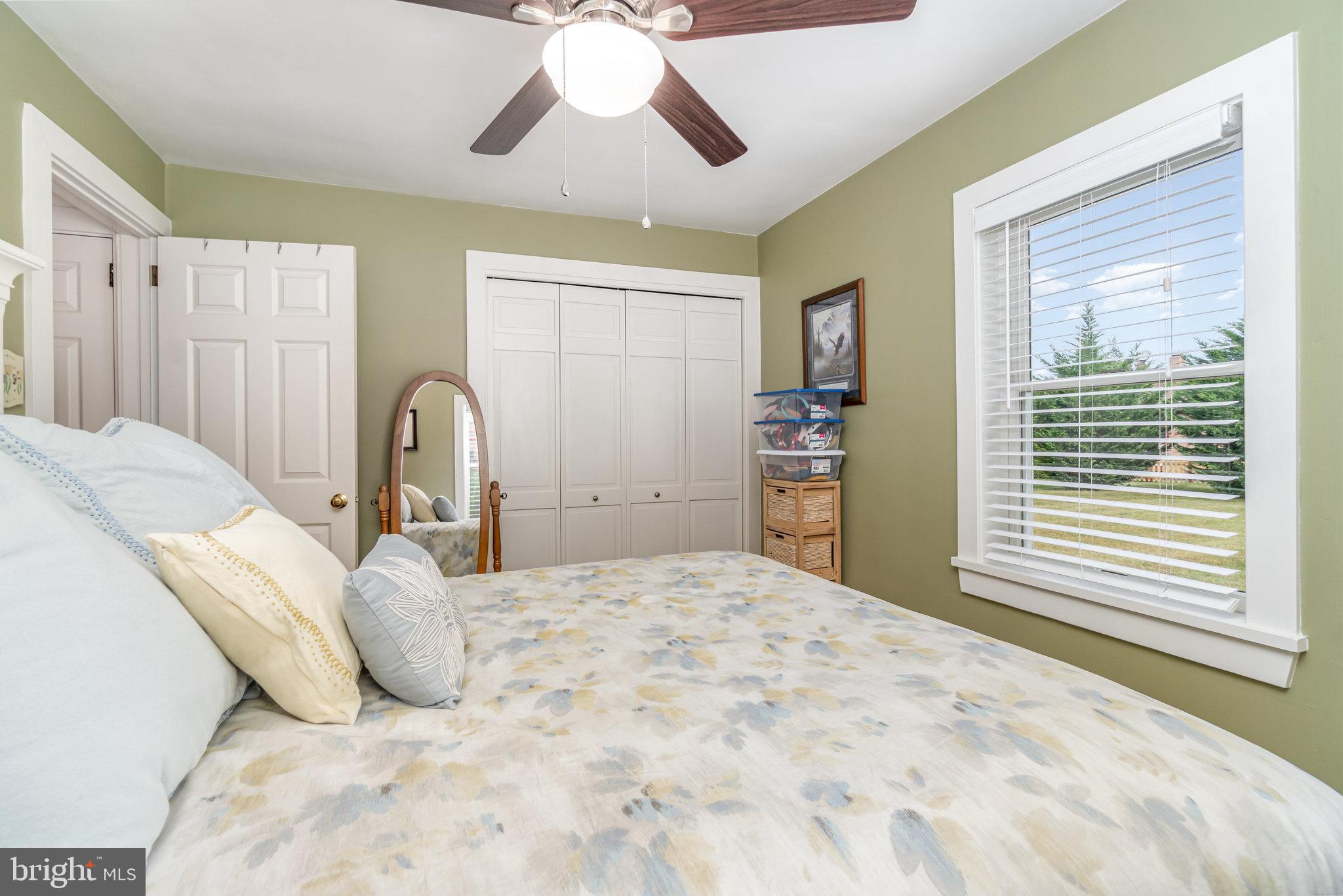 904 South 12th Street Lebanon, PA 17042 - Photo 16 of 32 a large bedroom with a bed and a chandelier