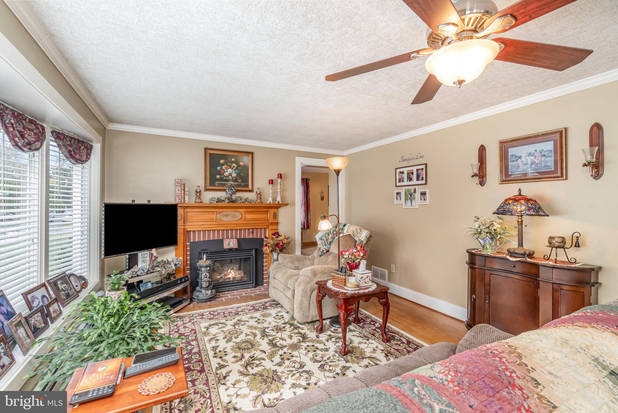 904 South 12th Street Lebanon, PA 17042 - Photo 4 of 32 a living room with furniture a flat screen tv and a fireplace