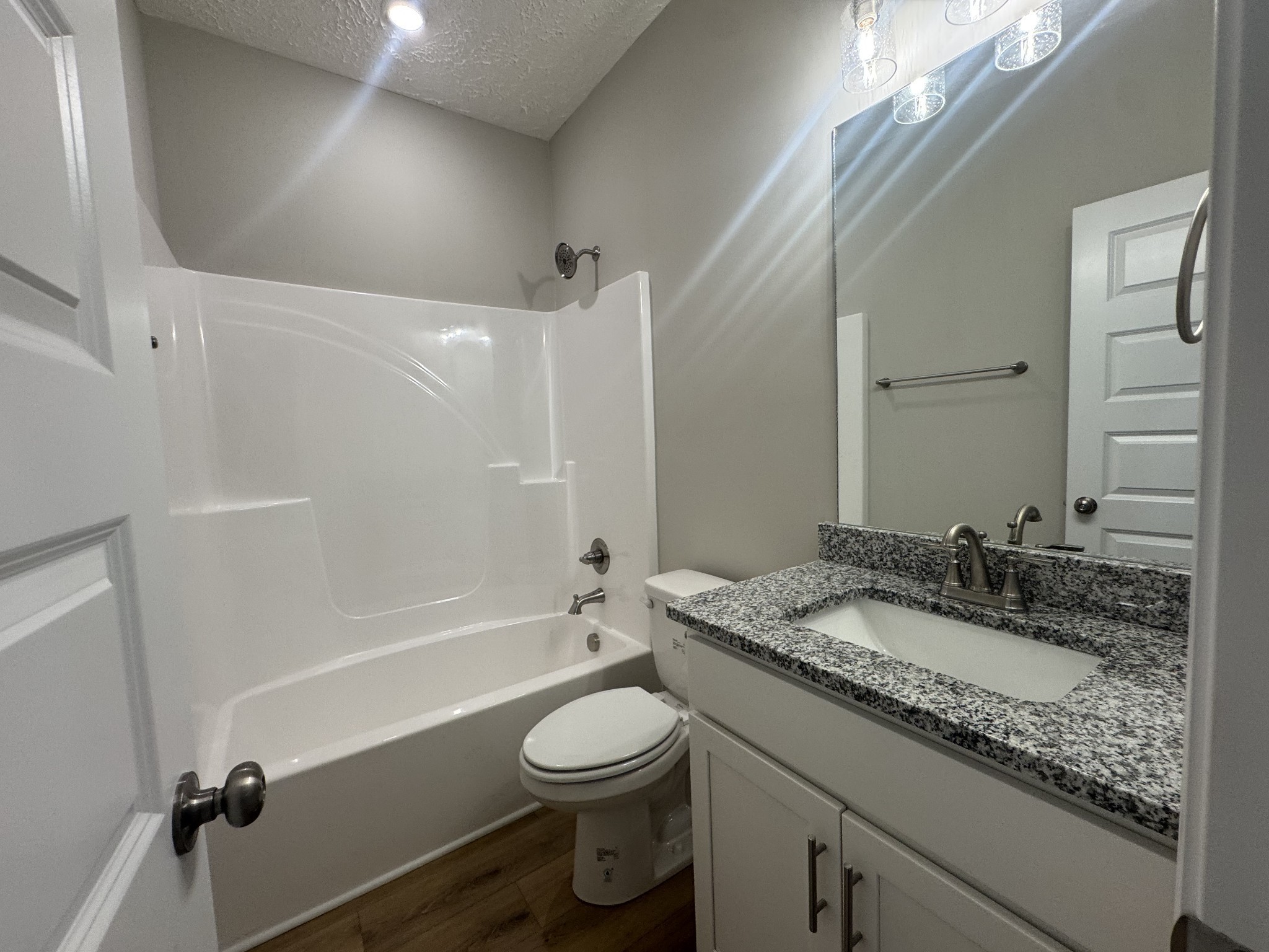 69 Laurel View Street Manchester, TN 37355 - Photo 12 of 15 a bathroom with a granite countertop sink toilet and shower
