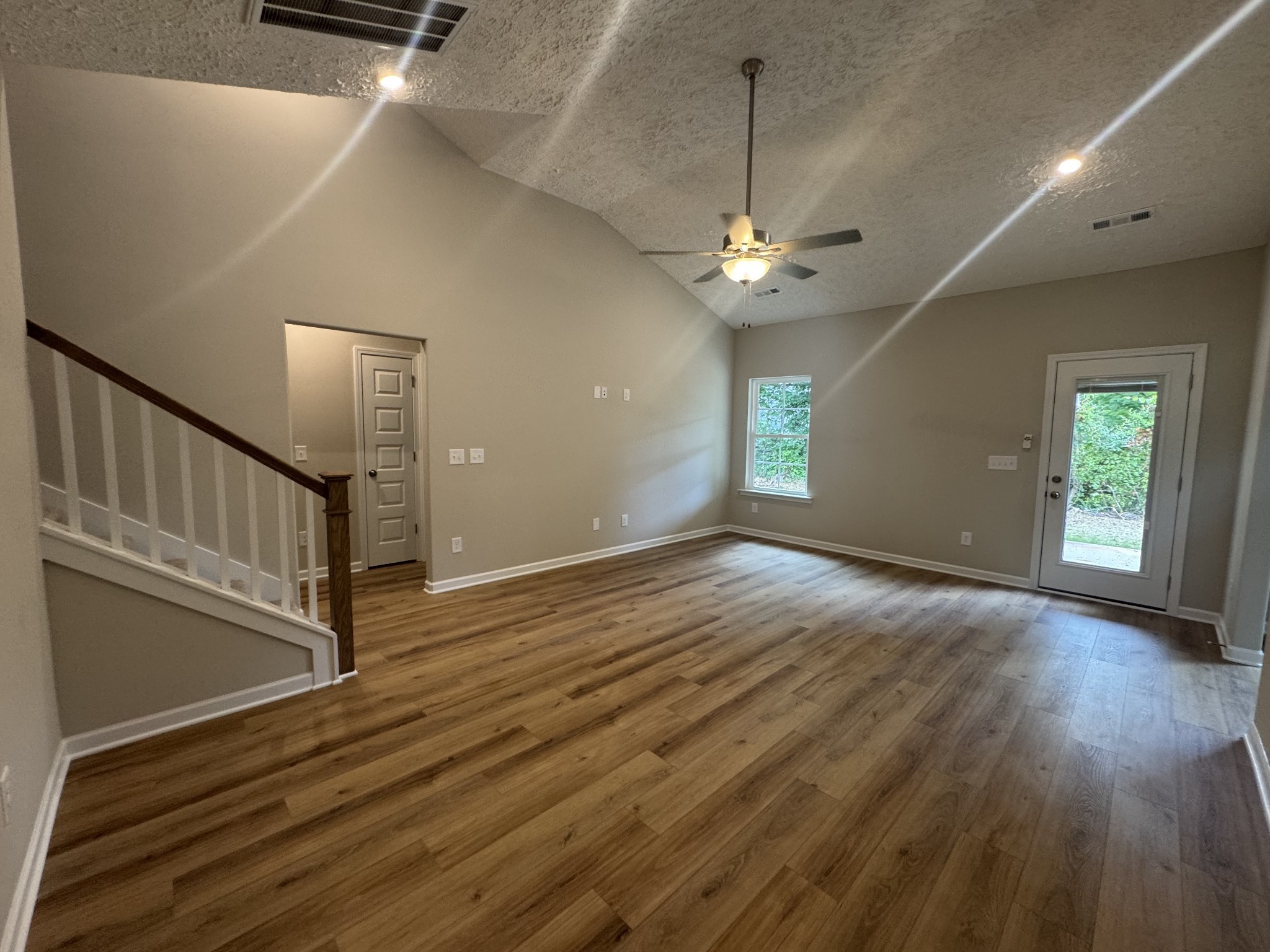 69 Laurel View Street Manchester, TN 37355 - Photo 5 of 15 wooden floor in an empty room with a window