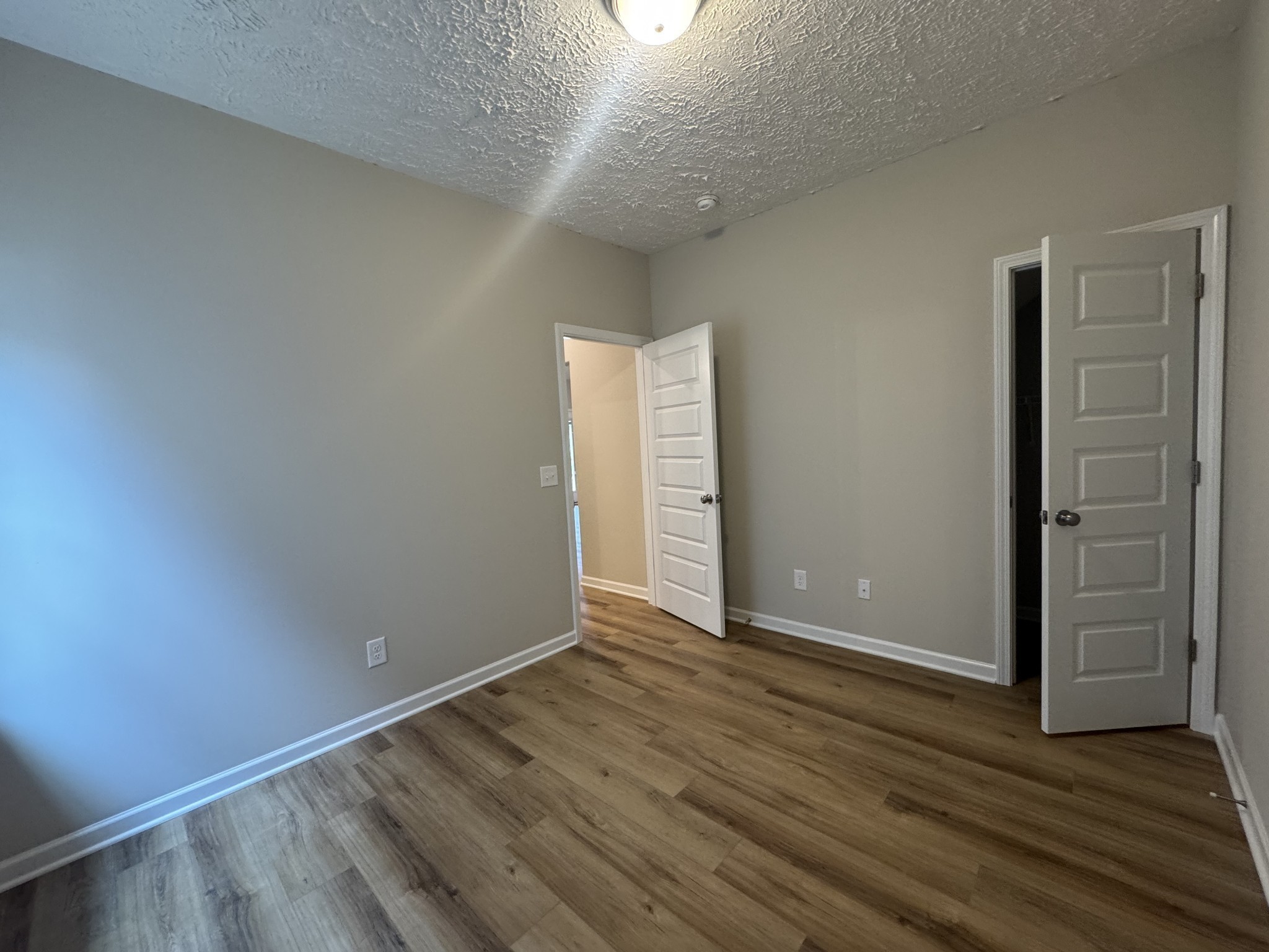 69 Laurel View Street Manchester, TN 37355 - Photo 10 of 15 an empty room with wooden floor & windows