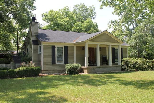 1591 Shepherd Road Madison, GA 30650 - Photo 1 of 1 a front view of a house with a garden