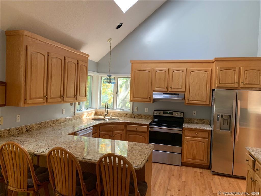 380 Huckleberry Hill Road Avon, CT 06001 - Photo 6 of 21 a kitchen with granite countertop a refrigerator stove and sink