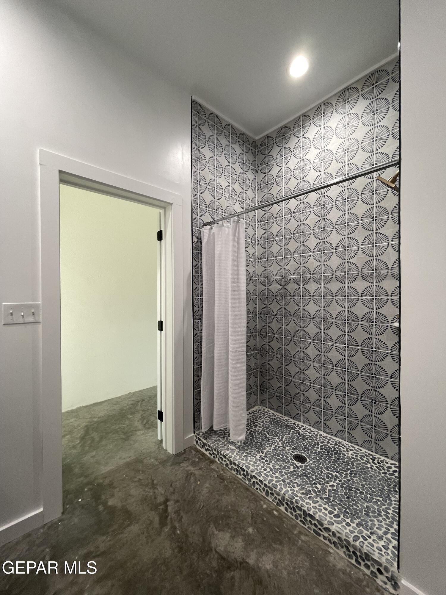 1402 Philadelphia Street Marfa, TX 79843 - Photo 11 of 11 a bathroom with a shower and a sink