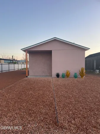 a backyard of house with garage
