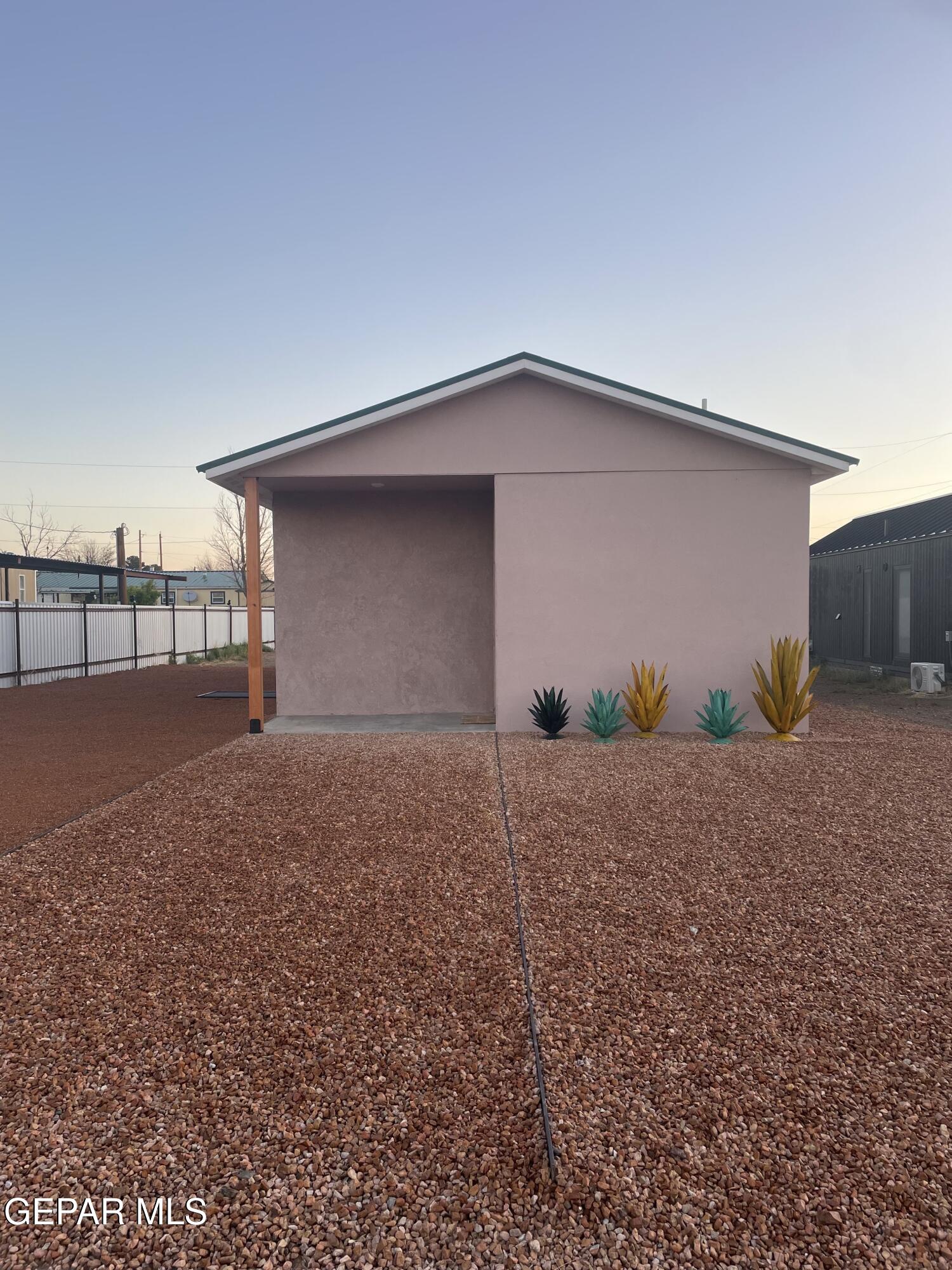 1402 Philadelphia Street Marfa, TX 79843 - Photo 2 of 11 a backyard of house with garage