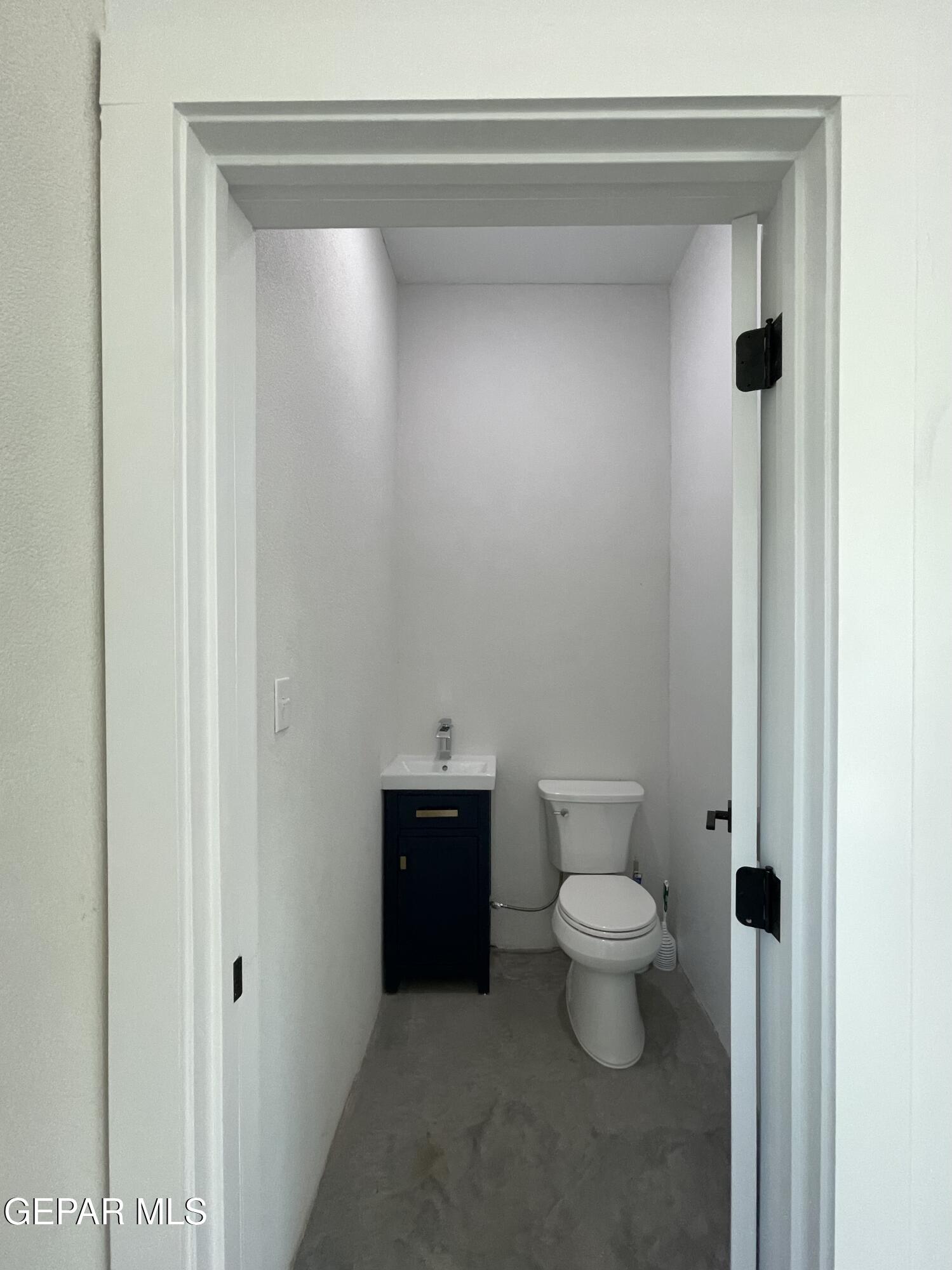1402 Philadelphia Street Marfa, TX 79843 - Photo 5 of 11 a bathroom with a toilet and a vanity