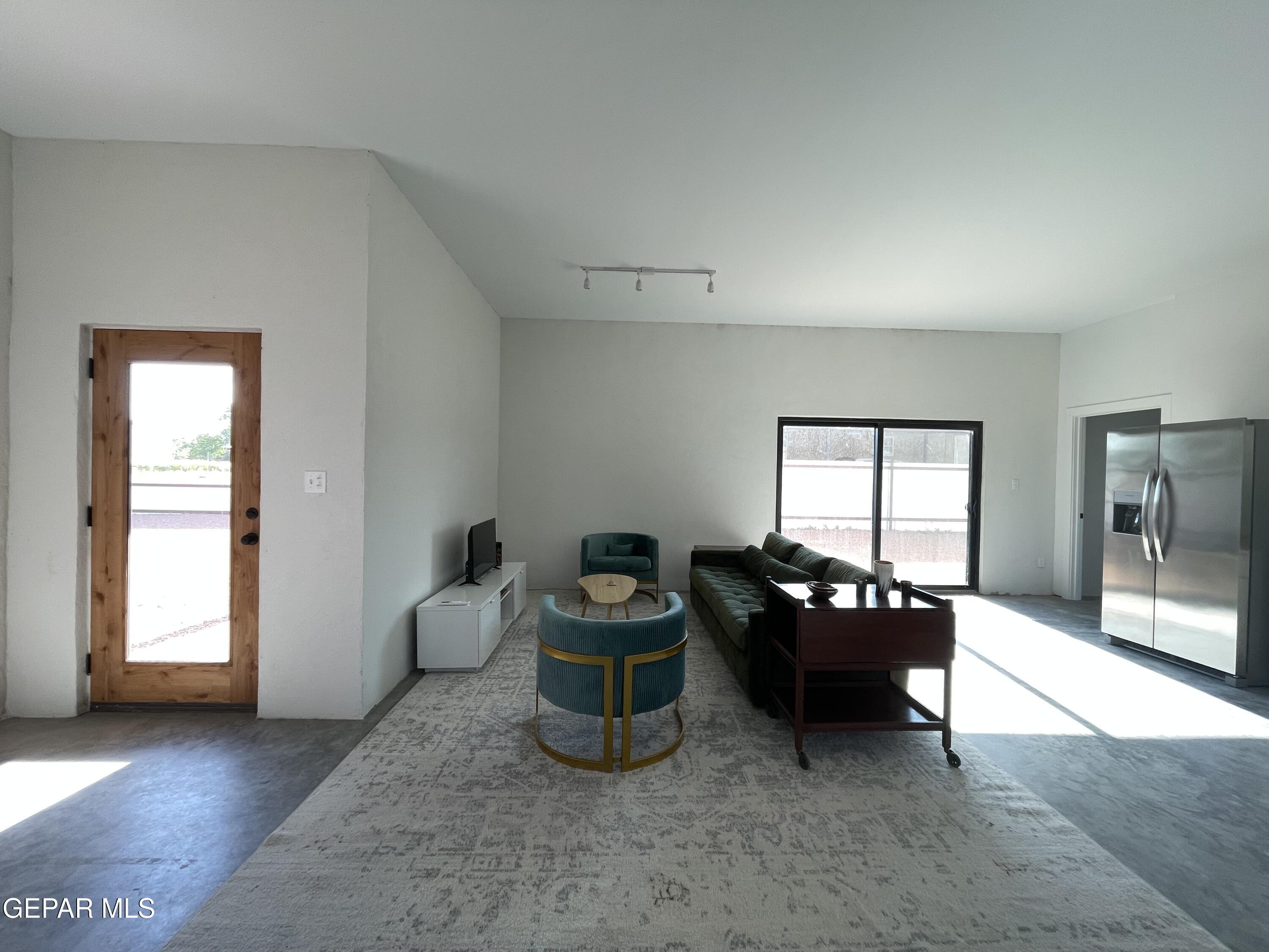 1402 Philadelphia Street Marfa, TX 79843 - Photo 6 of 11 a living room with furniture and a window