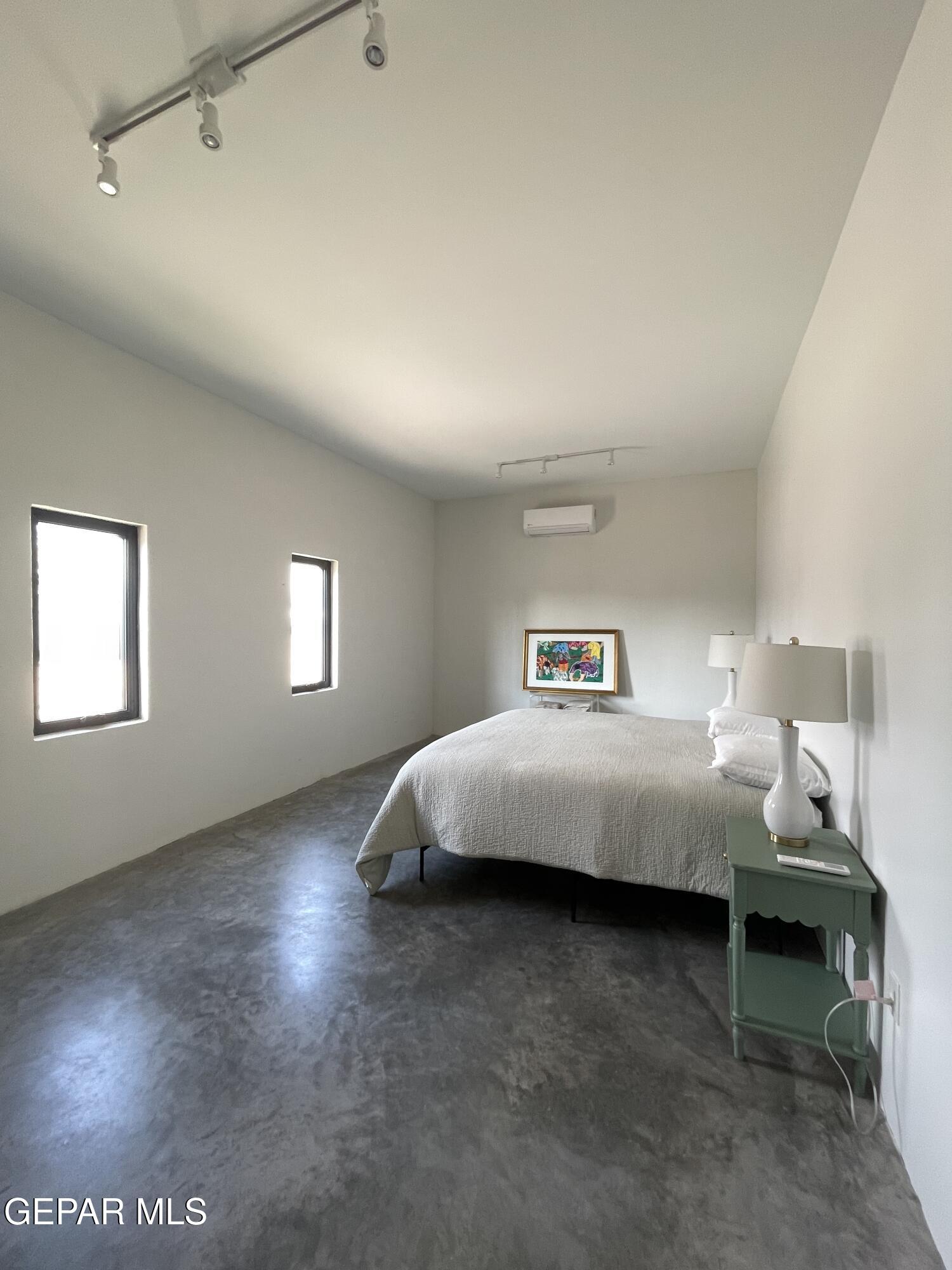 1402 Philadelphia Street Marfa, TX 79843 - Photo 8 of 11 a bedroom with a bed and a window