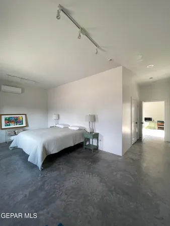 a bed room with a bed and a couch