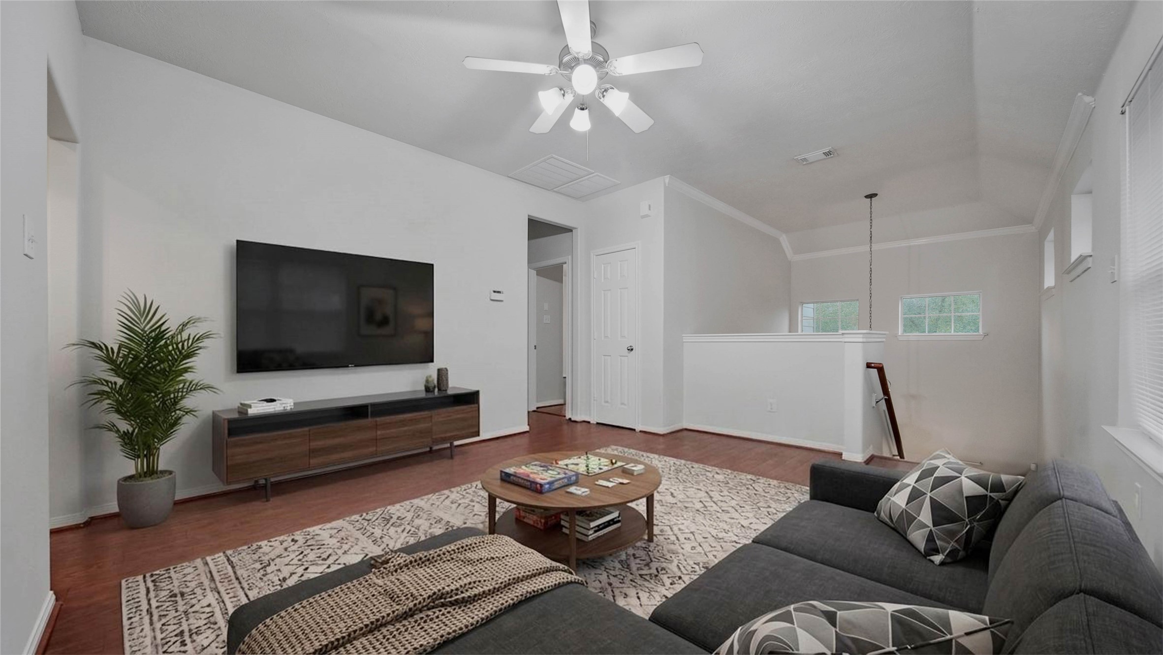 87 West Twinvale Loop Conroe, TX 77384 - Photo 15 of 19 a living room with furniture and a flat screen tv