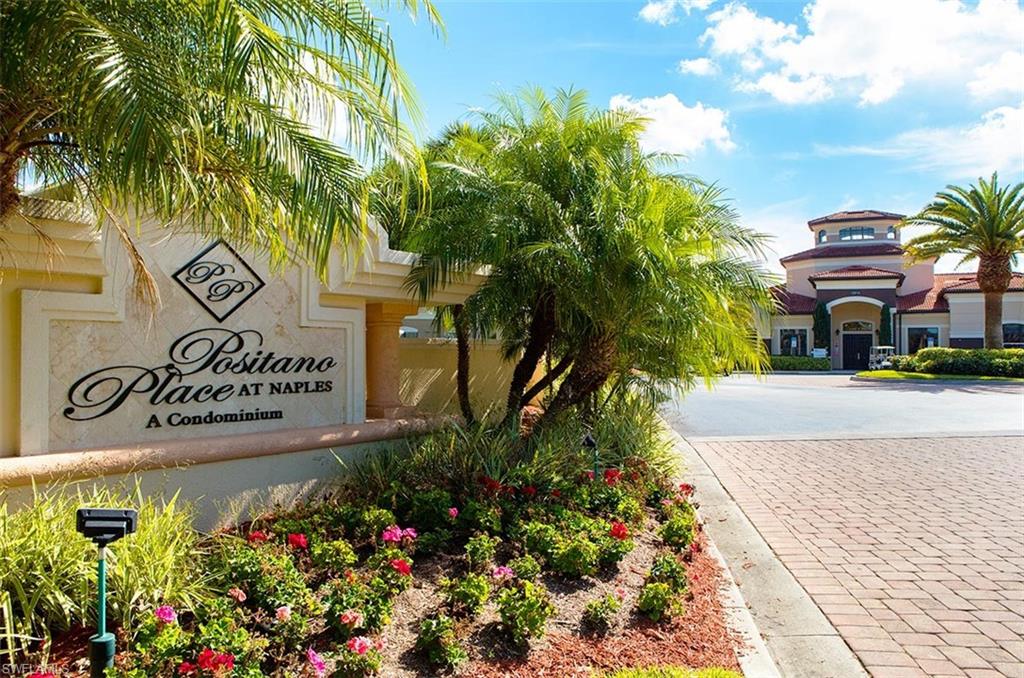 12990 Positano Circle, Unit 208 Naples, FL 34105 - Photo 13 of 20 a sign that is in front of flowers